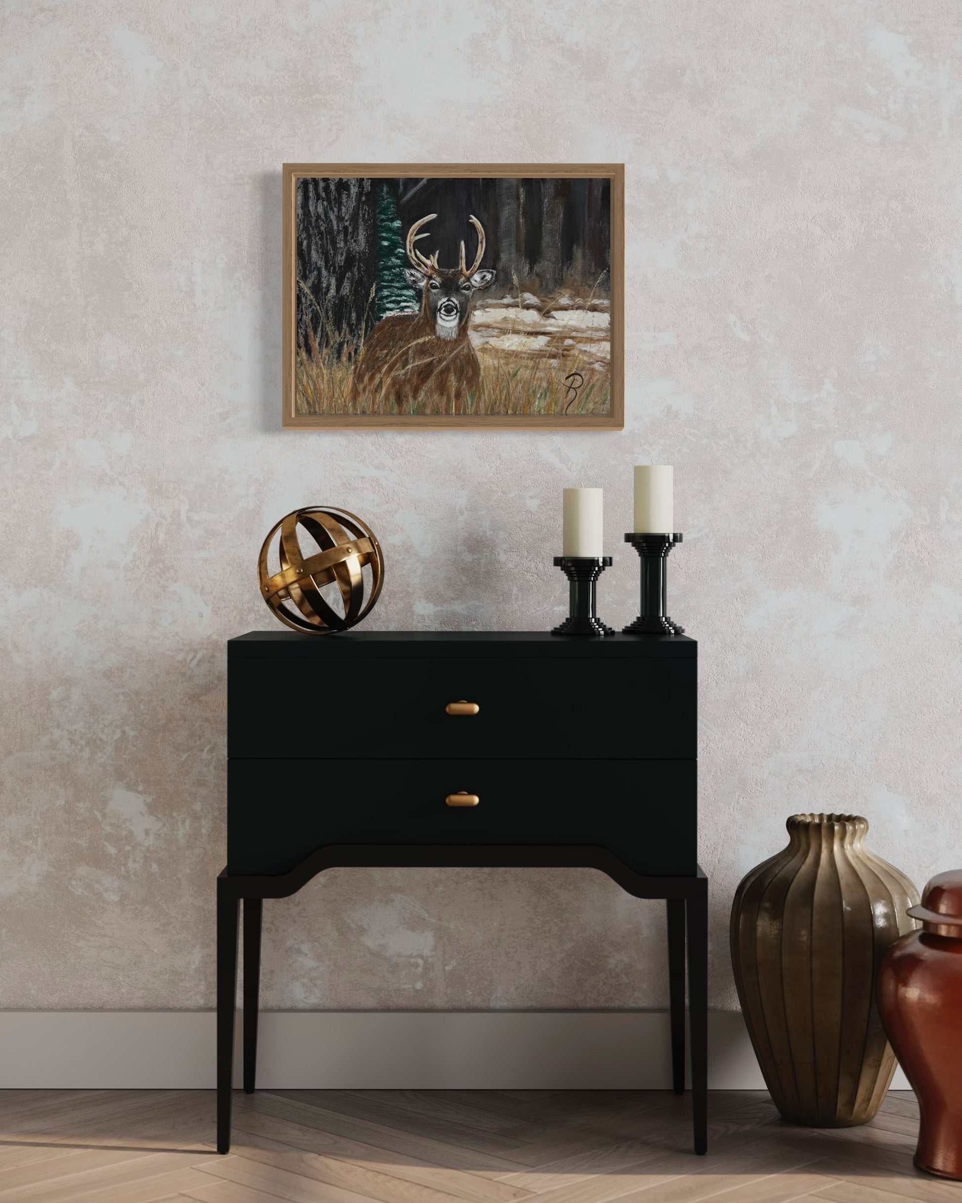 Deer painting above a black side table